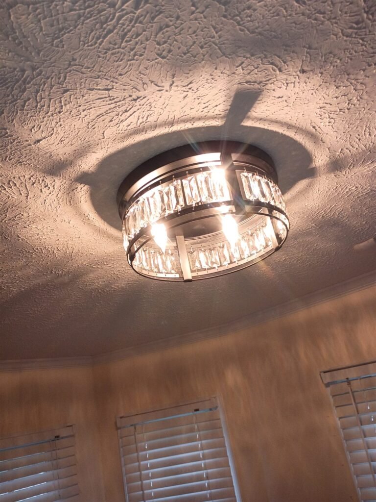 Chrome and crystal ceiling light fixture installed and lit in a Fayetteville NC home