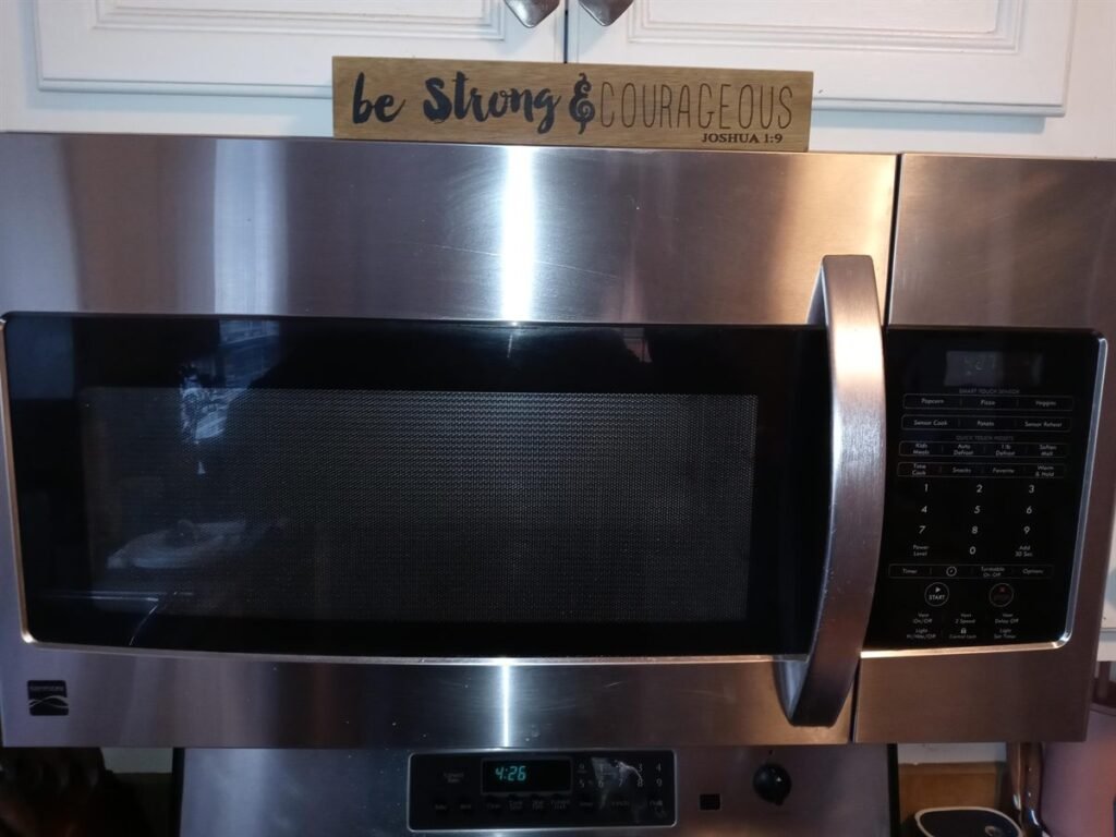 Over-the-range stainless steel microwave in a customer kitchen